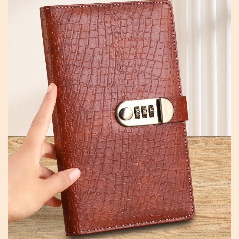 Savings binder held in hand to show its size